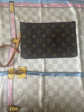 Monogram wristlet with soft pink interior